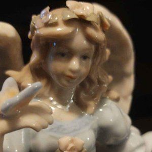 Porcelain Angel Figurine With Flower Basket Butterfly on Hand  - Music Box